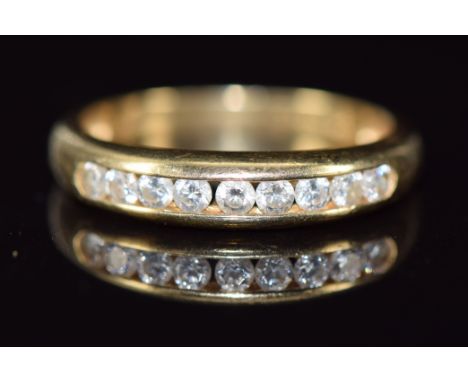 A 14k gold ring set with nine round cut diamonds, 2.7g, size P