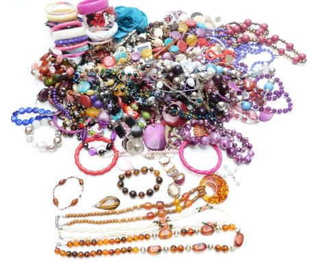 A collection of costume jewellery including beads, mother of pearl necklace, tiger's eye pendant, etc&nbsp;