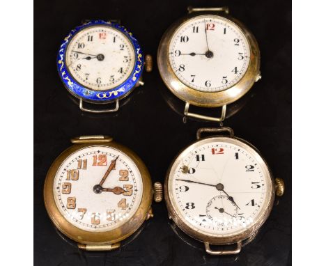 Four trench style wristwatches including two silver examples one with blue enamel bezel, largest case diameter 35mm.&nbsp;