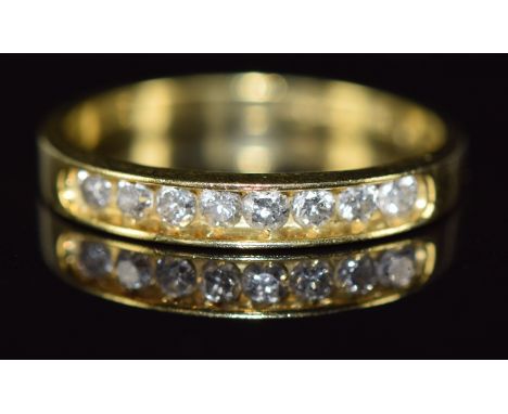 An 18ct gold half eternity ring set with eight diamonds totalling approximately 0.33ct, 2.6g, size O