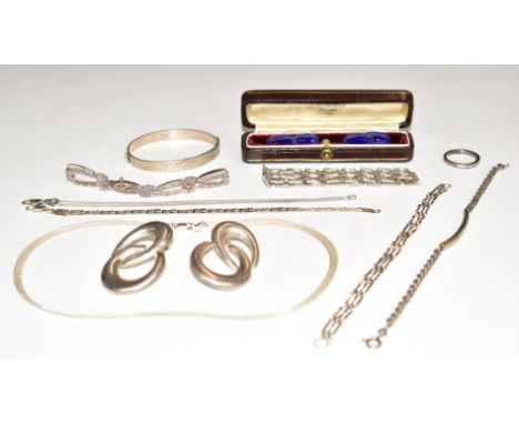 A collection of silver jewellery including earrings, bangle, cufflinks, bracelets and ring