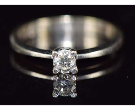 An 18ct white gold ring set with a round cut diamond of approximately 0.19ct, 2g, size K