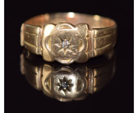 A 9ct gold ring set with a diamond in a star setting, 2.7g, size R