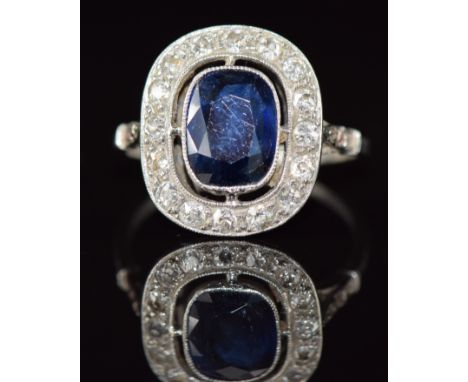 Art Deco&nbsp;Fontana&nbsp;platinum ring set with a cushion cut sapphire of approximately&nbsp;1.4ct surrounded by diamonds, 