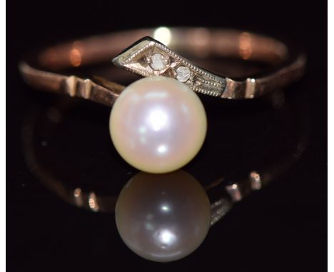 A 9ct gold ring set with a pearl and white sapphires, 1.9g, size L