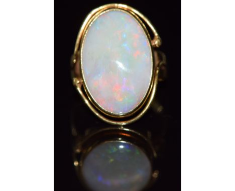 An 18ct gold ring set with an opal cabochon, 5.7g, size K&nbsp;