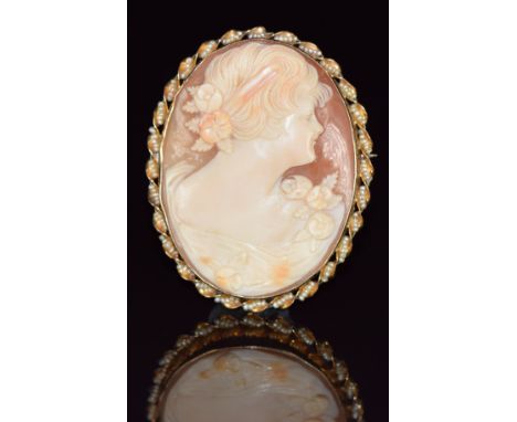 A 14k gold brooch set with a cameo with seed pearl rim, 11.4g, 4.5 x 3.5cm