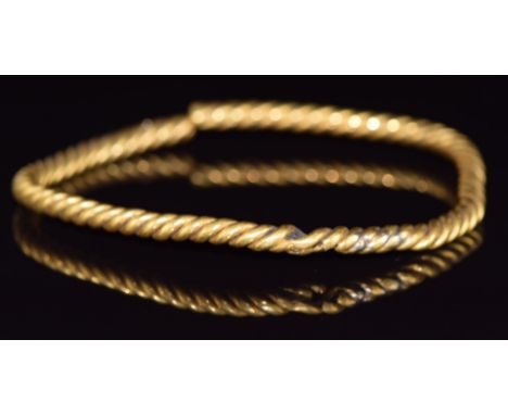 A yellow metal rope twist section of bangle, 66.4g&nbsp;