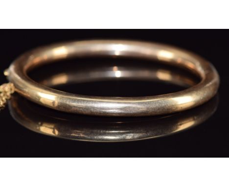 A 9ct gold bangle, 11.9g, 5.7 x 5cm