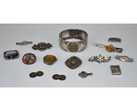 Five Victorian/ Edwardian silver brooches, silver locket, Scottish silver brooch, silver bangle with added watch face, three 