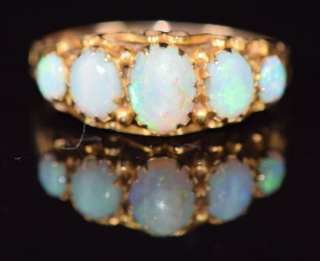 A 9ct gold ring set with five opal cabochons, Birmingham 1923, maker NBs, 1.6g, size R