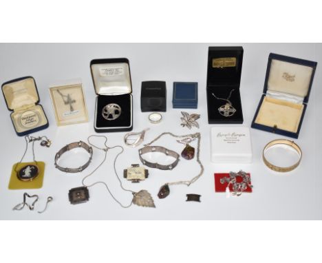 A collection of silver jewellery including brooches, ring, two Palestine bracelets, Wedgwood brooch, etc