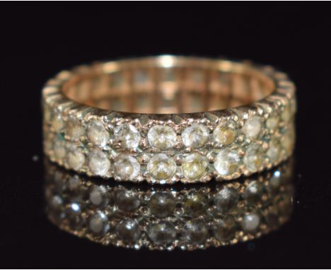 A 9ct gold eternity ring set with two rows of spinel, 3.1g, size K