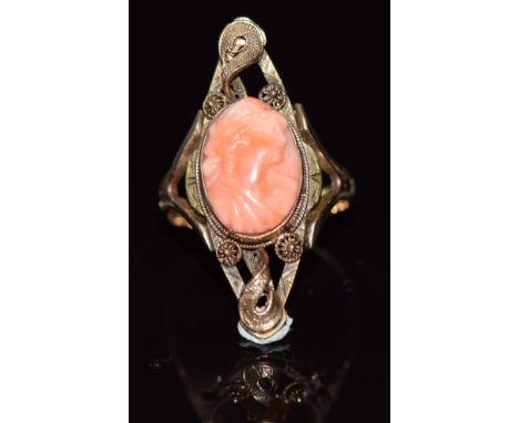 A 14k gold ring set with a coral cameo and filigree decoration, 4.8g, size Q/R