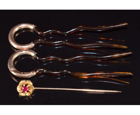 A 9ct gold stick pin set with a ruby (2.2g) and tortoiseshell hair pins mounted with 9ct gold