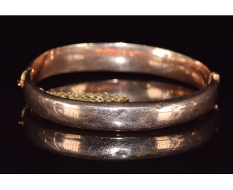 A 9ct rose gold bangle, Birmingham 1917, 10.2g, 5.5 x 5.3cm&nbsp;