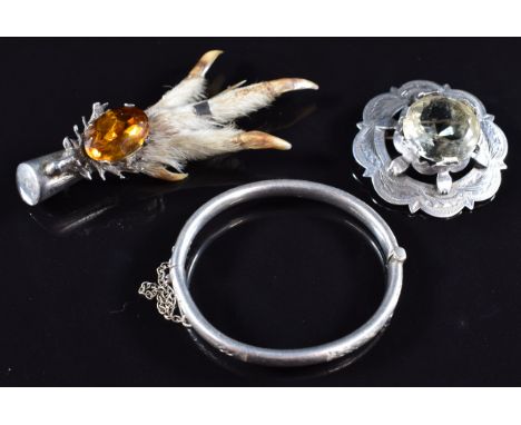 Scottish silver brooch by WBs, silver christening bangle and silver mounted rabbit's foot