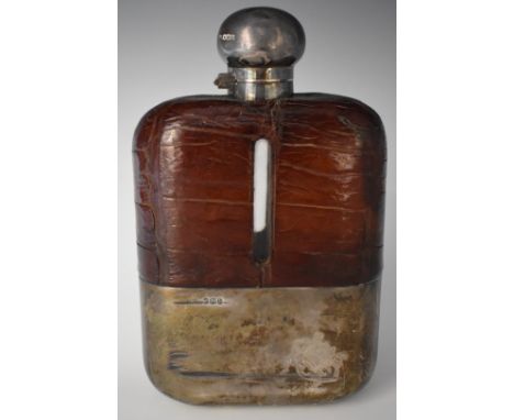 George V hallmarked silver novelty oversize hip flask with crocodile skin covered glass vessel, silver pull off cup and hinge