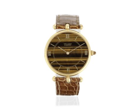 Piaget for Van Cleef &amp; Arpels. A lady's 18K gold and tigers eye manual wind wristwatchModel: ClassiqueDate: Circa 1990Mov