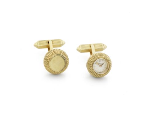 Omega. An 18K gold manual wind timepiece in the form of a cufflink with matching pairMovement: Jewelled manual windDial: Silv