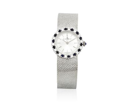 Baume &amp; Mercier. A lady's 18K white gold manual wind diamond and sapphire set bracelet watchDate: Circa 1980Movement: 17-