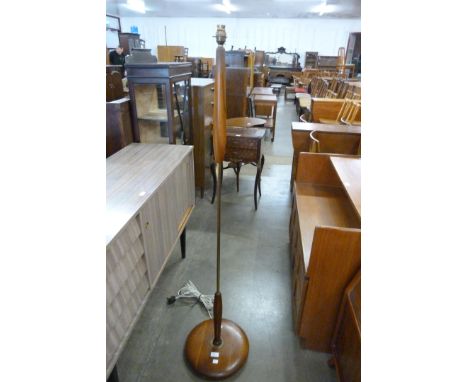 A teak standard lamp 