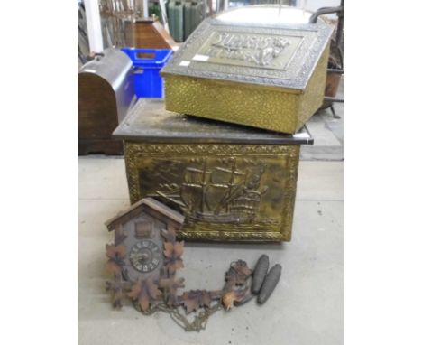 A brass coal bin, a brass embossed slipper box and a cuckoo clock 