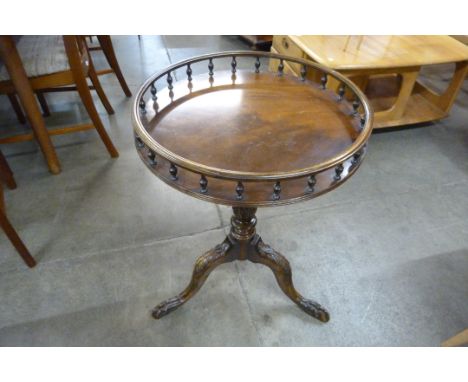 A Chippendale Revival carved mahogany tripod wine table 