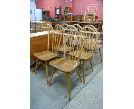 A set of four Ercol Blonde elm and beech 391 model chairs 