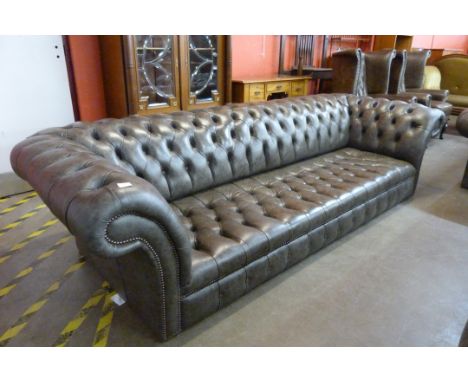 A grey leather Chesterfield settee 