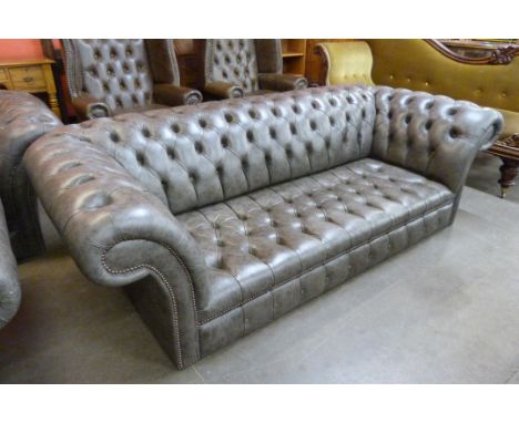 A grey leather Chesterfield settee