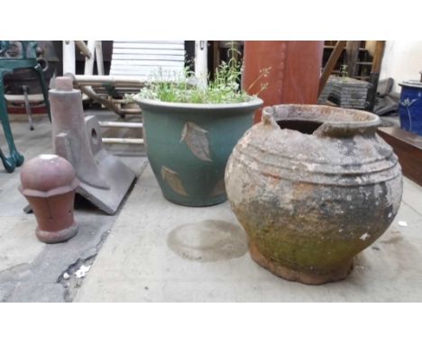 A terracotta roof finial and two garden planters 