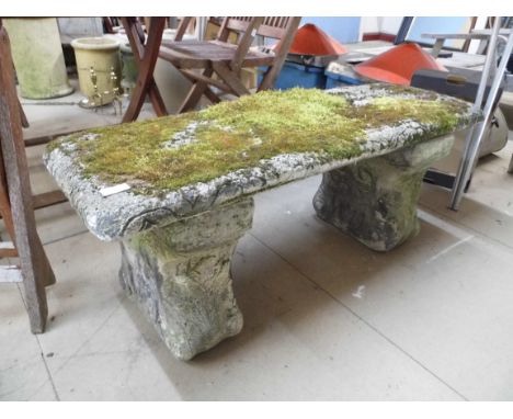 A concrete pedestal garden bench 