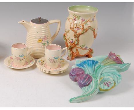 A collection of various Clarice Cliff pottery wares, to include; Bonjour Lynton part coffee set comprising coffee pot and cov