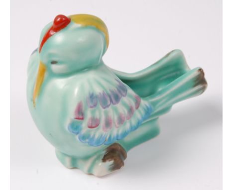 A Clarice Cliff pottery pipe-holder modelled as a seated comical bird, bright colour painted, printed backstamp verso, length