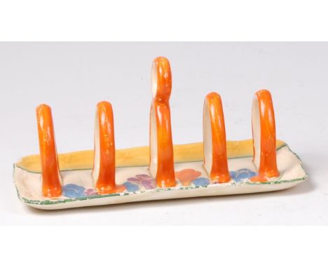 A Clarice Cliff Crocus pattern four division toast-rack, having five lancet shaped bars with central circular holder, black p