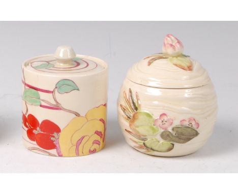 A Clarice Cliff Amber Rose pattern pottery cylindrical preserve pot and cover, with black printed and Made in England backsta