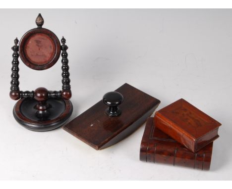 A 19th century mahogany pocket watch holder, on bobbin turned supports and circular base, h.17cm, together with a beech desk 