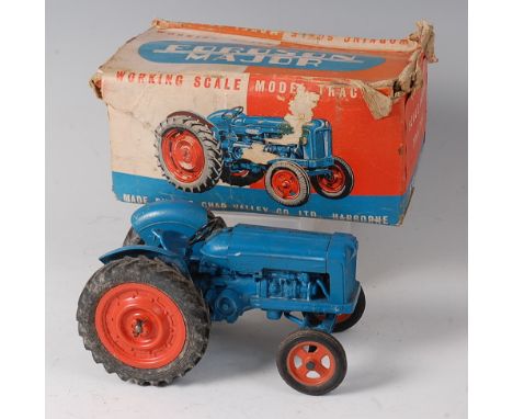 A Chad Valley heavy diecast clockwork model of the New Fordson Power Major tractor, comprising blue diecast and tinplate body