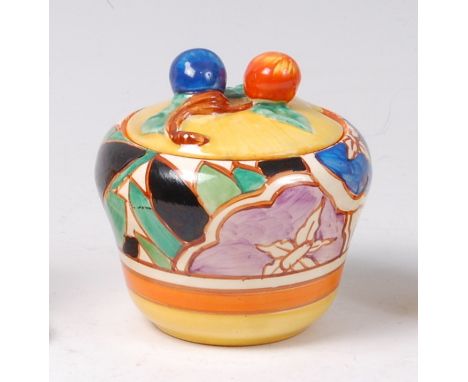 A Clarice Cliff Gardenia orange pattern pottery preserve pot and cover, of circular shouldered tapering form, with black prin