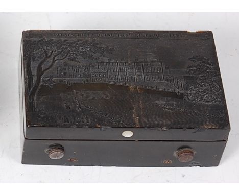 A 19th century French pressed horn cased travelling music box, the cover depicting Le Palais de la Reine, the 6.5cm cylinder 