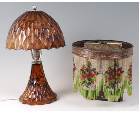 A 1920s moulded cloud glass table lamp with shade, 36cm; together with a circa 1900 hammered copper shade, having coloured gl