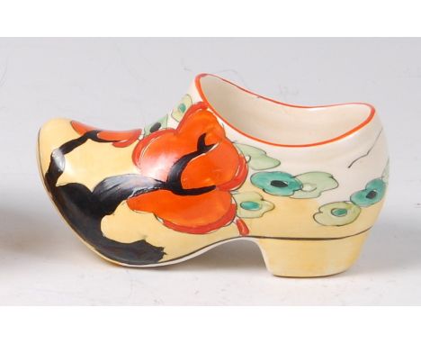 A Clarice Cliff Orange Erin pattern pottery clog, typically bright colour painted, with black printed backstamp verso, length