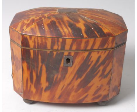 A George III tortoiseshell and white metal inlaid tea caddy of domed octagonal form, the hinged lid revealing a twin compartm