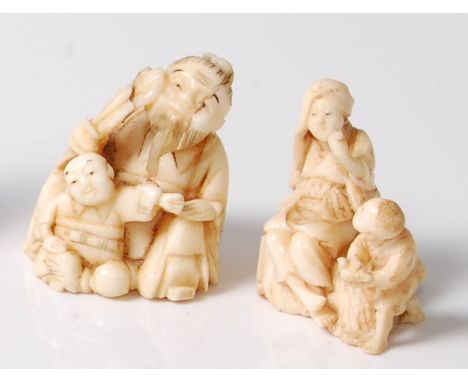 A Japanese Meiji period carved ivory netsuke group, as a farmer smoking his pipe with attendant child holding a small bird at