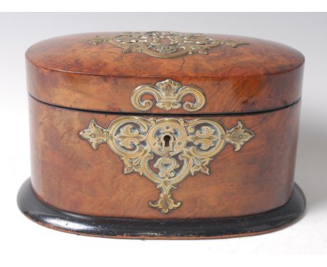 A Victorian figured walnut and brass mounted tea caddy of oval form, the lid opening to reveal a green velvet underside, stam