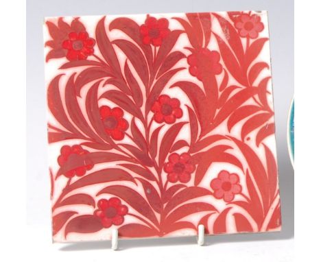 An Arts & Crafts ruby lustre decorated pottery tile, possibly William de Morgan, depicting leaves and flowers, with raised M 