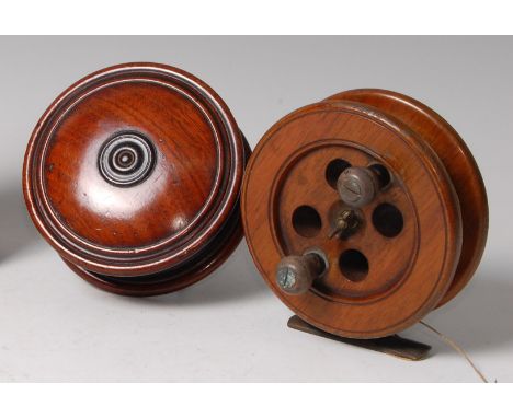 A 19th century turned mahogany table top snuff-box, of circular form, together with Victorian beech fishing reel, the brass a