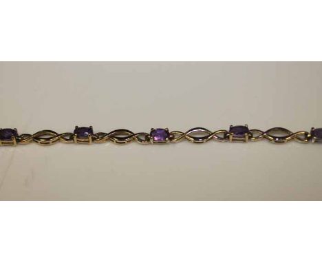 NINE CARAT GOLD AMETHYST BRACELET
set with oval cut amethysts, 4.9g, 19.5cm long