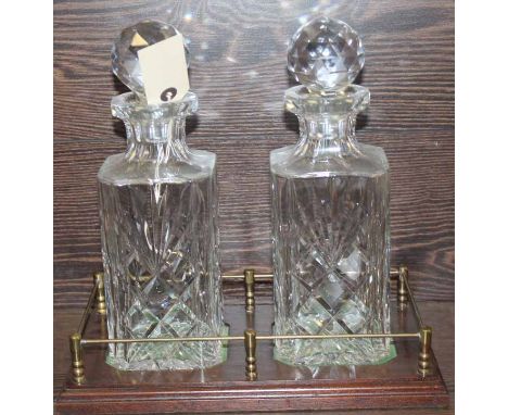 PAIR OF CUT CRYSTAL ROYAL BRIERLEY DECANTERS WITH STOPPERS
on a galleried wooden stand 